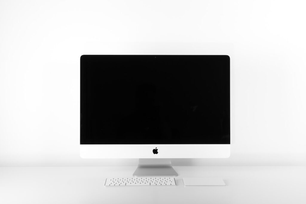 Modern home office desk setup with 27 inch monitor